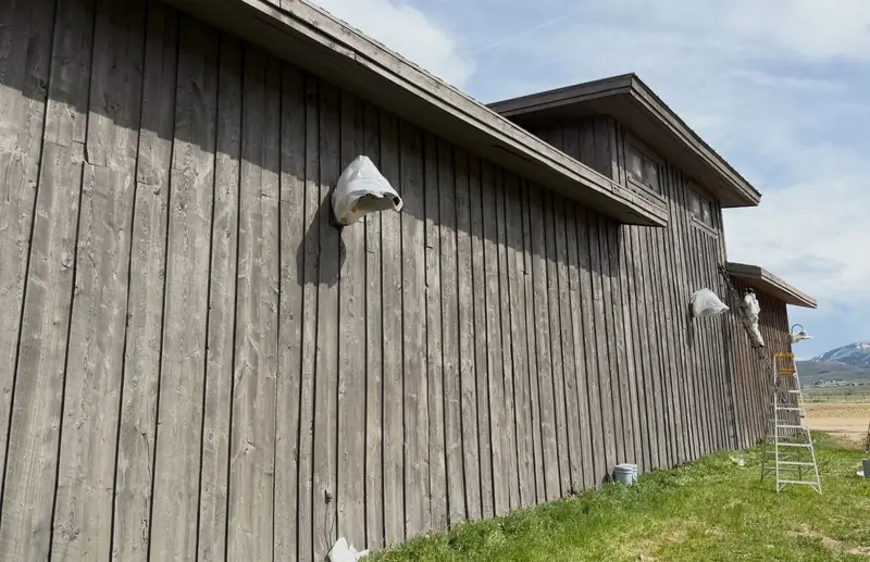Refinished vertical wood siding on the side elevation of the equestrian facility at Promontory, Park City, Utah – exterior wood stain